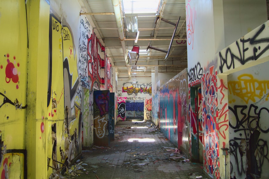 abandoned, graffitied hallway at the Pines Resort