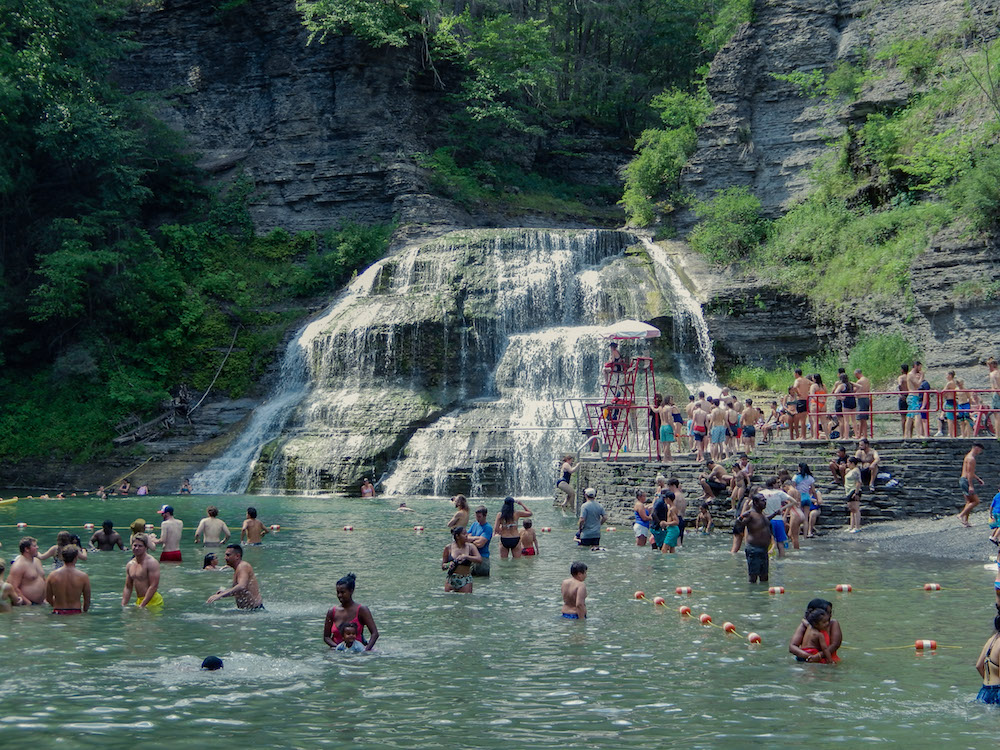 Waterfall Basic Swimming Area in Ithaca, NY. Full of people swimming